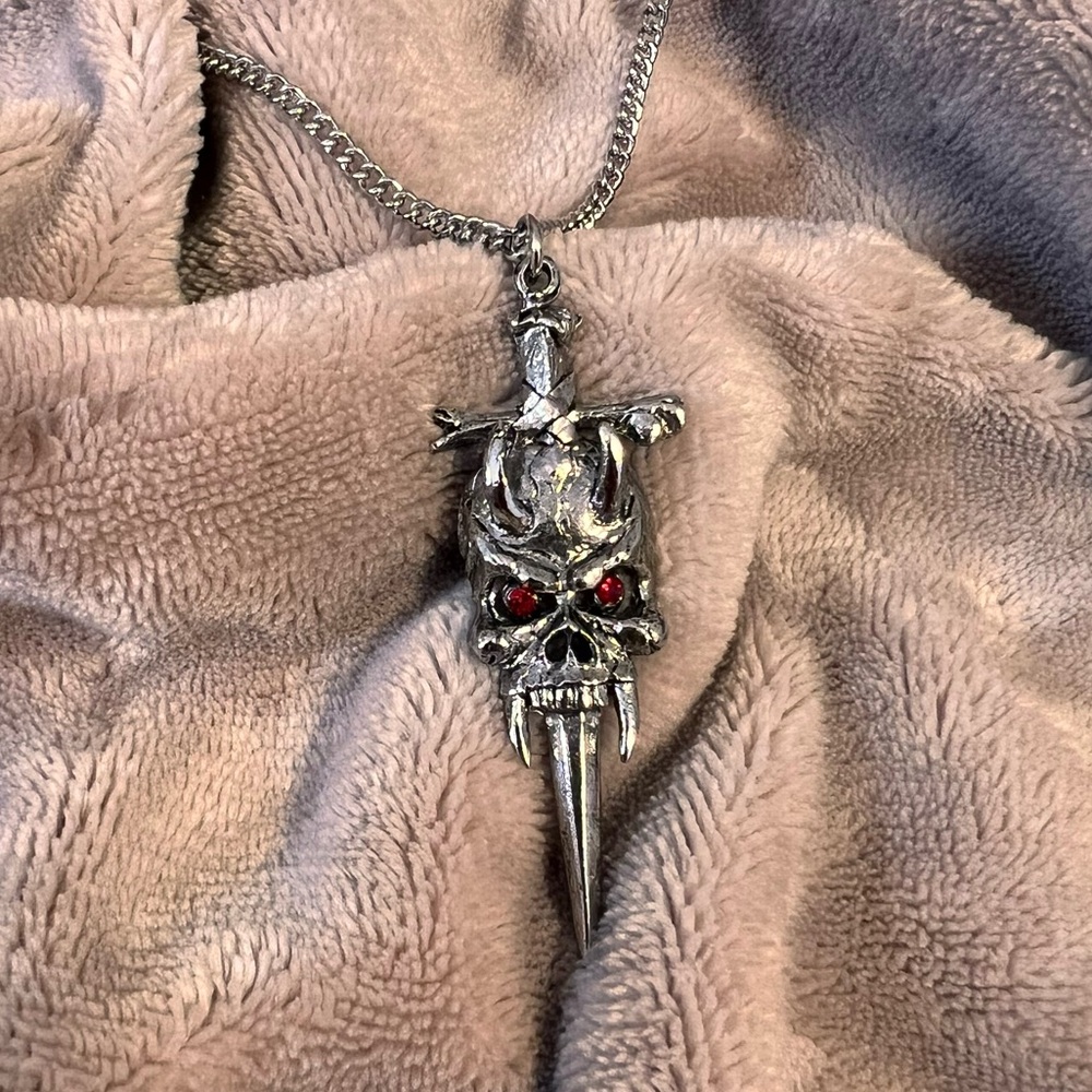 SPENCERS Chunky Silver Skull and Dagger Gothic Necklace with Red Crystals